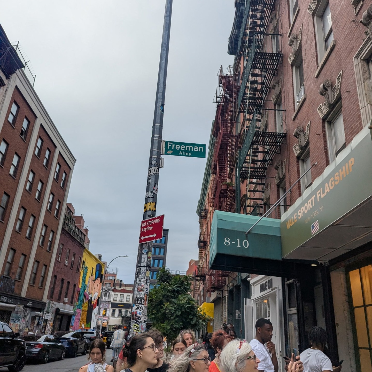 Tour group at Freeman Alley street sign in Lower East Side