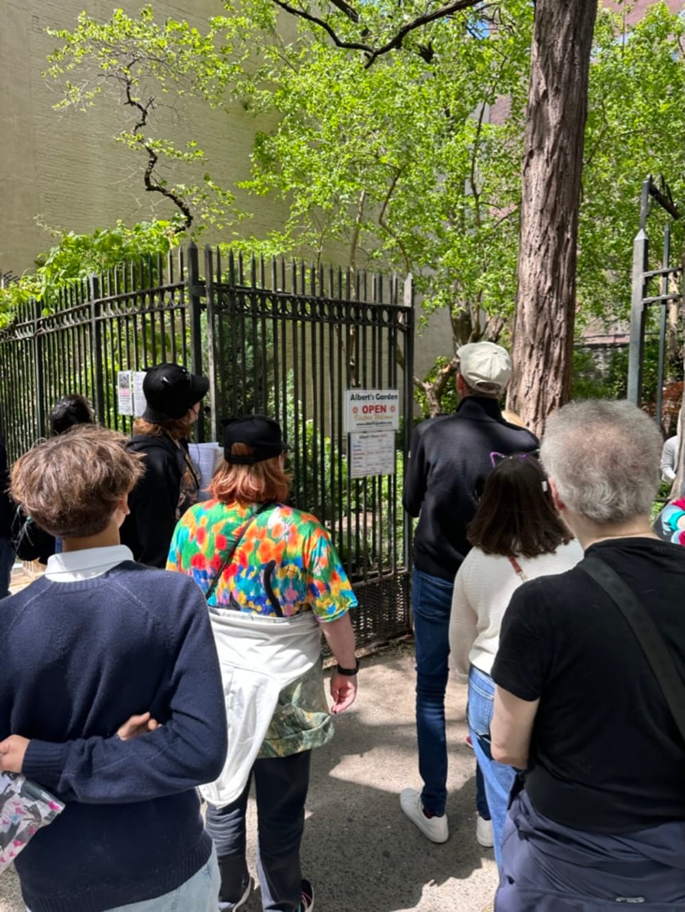 Tour group entering Albert's Garden community space