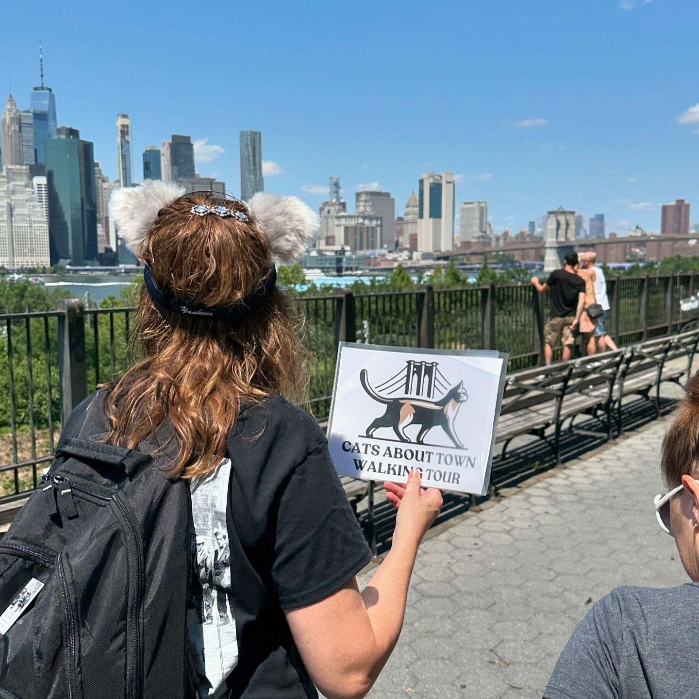 Tour guests learning about Brooklyn Heights feline history