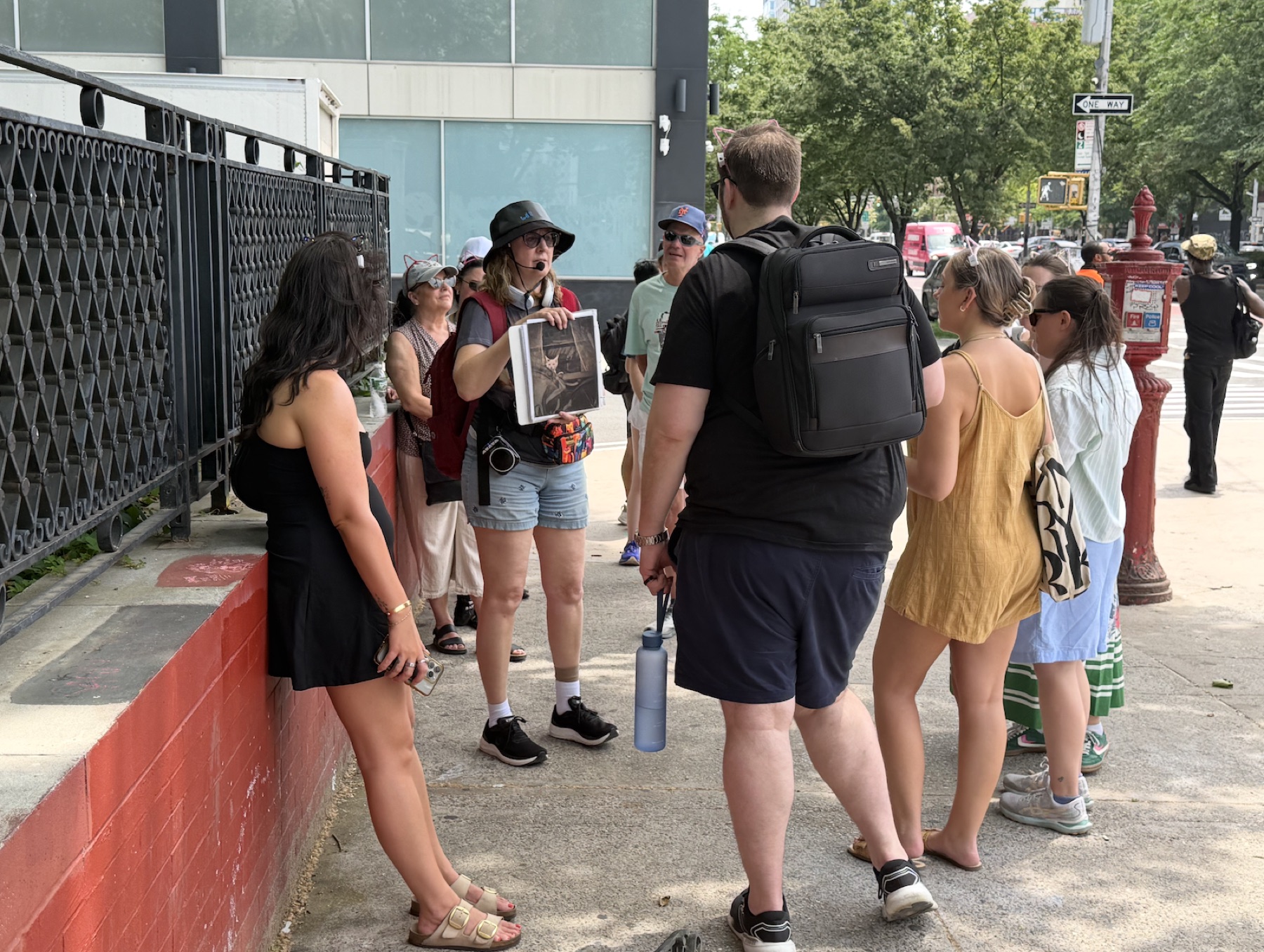 Cats About Town Tours group listening to Lower East Side cat history near Orchard Street